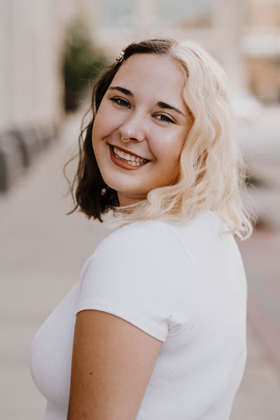 senior smiling over shoulder